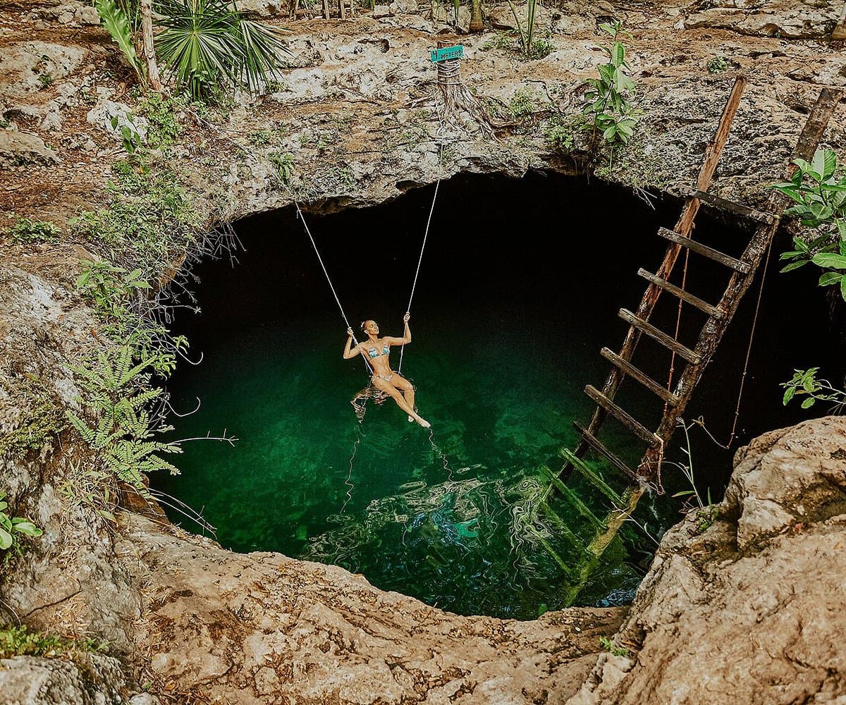 The three openings of Cenote Calavera near Tulum seen from above