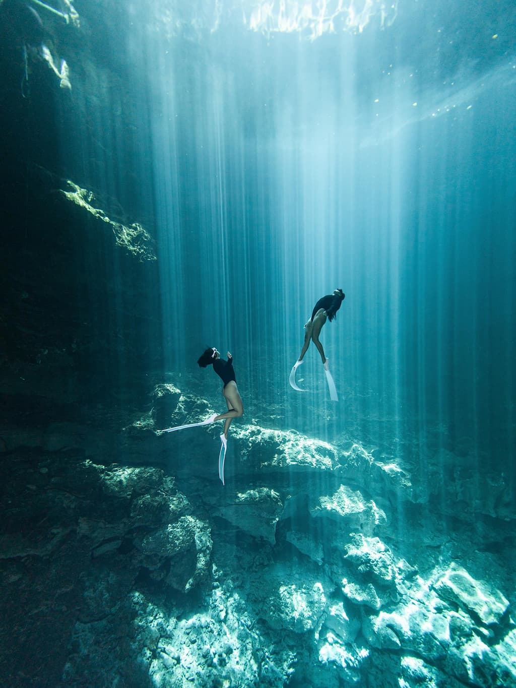 Crystal clear water and cave formations at Cenote Dos Ojos near Tulum