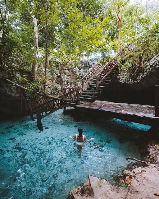 Turquoise water and wooden walkways at Gran Cenote near Tulum