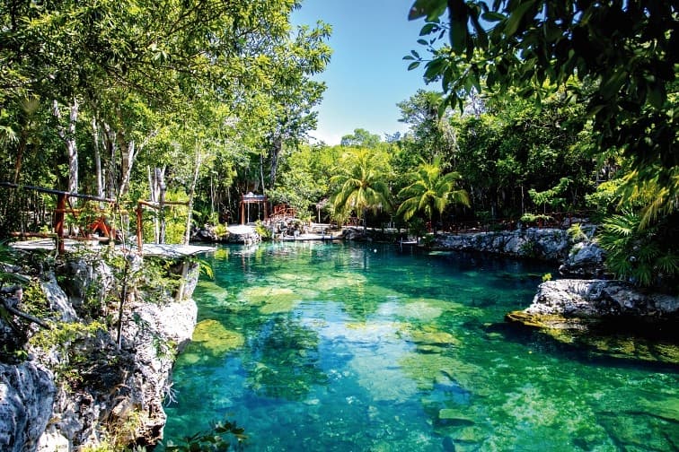 Zip line over the open water at Cenote Zacil-Ha